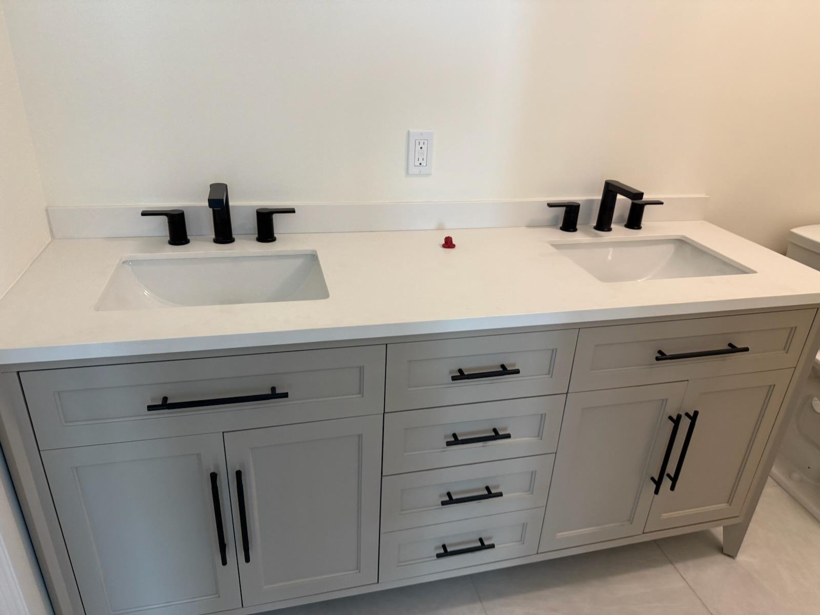 Hand with remote control directed on air conditioner